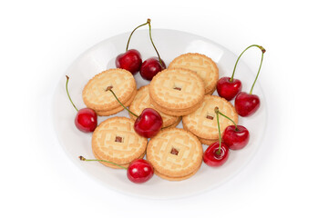 Sandwich cookies with cherry jam filling among the fresh cherries