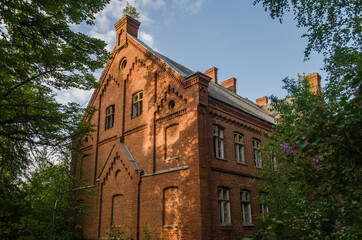 Fototapeta na wymiar Abandoned red brick Roze school, Latvia.