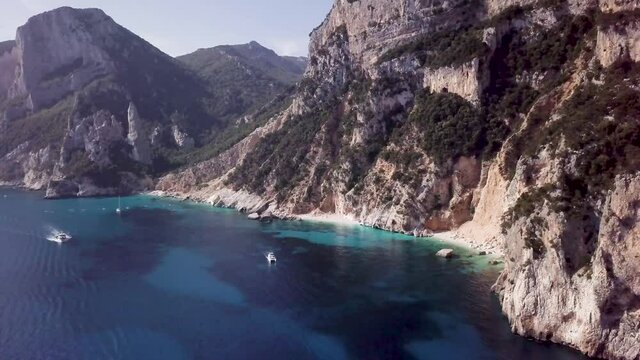 Stunning aerial view of a beautiful hidden beach with a turquoise water. Cala Goloritze beach, Sardinia, Italy.