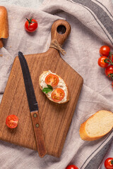 board, bread and tomatoes for making sandwiches