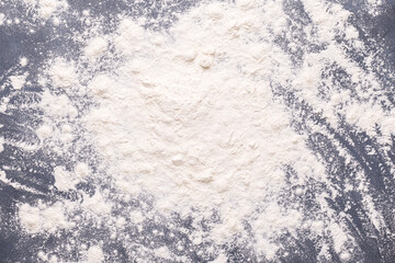 Baking or cooking background, flour on the dark background
