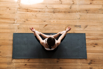 Young white sporty woman exercising