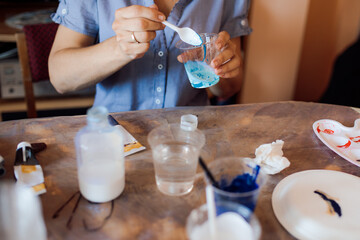 artist working on creating picture in art studio. Interior painting. Hobbies and crafts. Happiness and creativity.