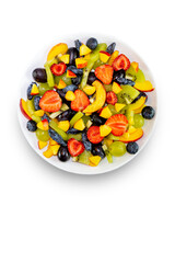 Fruit salad in a white plate, bowlmade of fresh fruits from grapes, nectarine, kiwi and strawberries, blueberries, honeysuckle, isolated on a white background.Top view, copy of the space