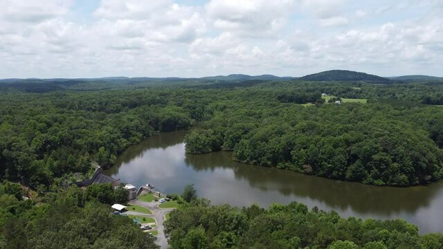 A high angle view of the lake and landscape with hills in the North Carolina countryside in 4K