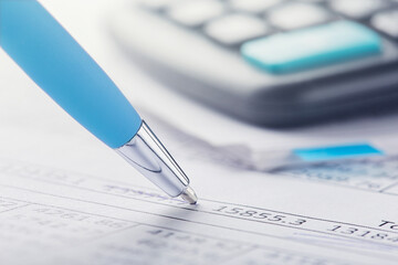 accounting document with pen and calculator. Concept of banking, financial report and financial...