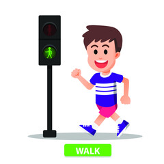 boy walks according to the pedestrian light indicator