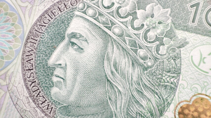 Macro PLN Polish 100 zloty banknotes background. One hundred zloty banknotes. extreme closeup detail Władysław II Jagiełło face on a bank note - obrazy, fototapety, plakaty