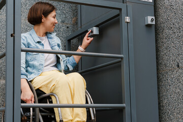 Mid aged smiling brunette disabled woman