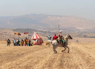 Horse and foot warriors - participants in the reconstruction of Horns of Hattin battle in 1187, are...