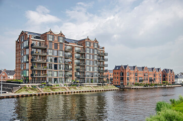 Oegstgeest, The Netherlands, July 11, 2021: recently built residential buildings on the banks of...