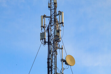 Mobile towers during the day against the blue sky
