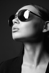 Beautiful woman in glasses. Lady Girl in trendy sunglasses