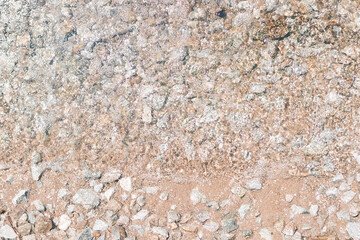beautiful ripples on the river flow over colorful stones in the rays of the summer sun top view