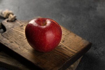 red apple on wooden table