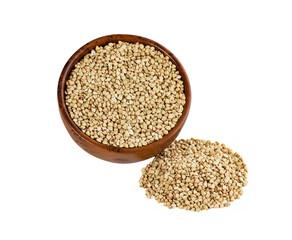 Green buckwheat grains in a wooden cup isolated on white.
