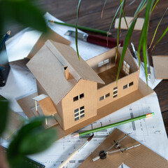 Building new home - design scale model of modern house. Real estate concept.