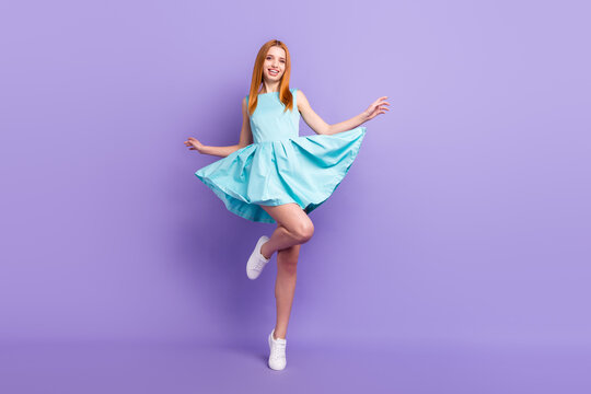 Full length photo of charming happy nice young woman fly skirt legs good mood summer isolated on violet color background