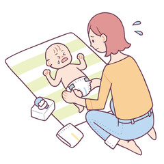 オムツ替えをする女性