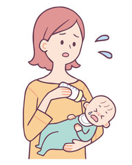 赤ちゃんにミルクを飲ませる女性
