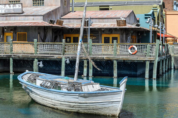 Fototapeta na wymiar Abandoned boat at the dock