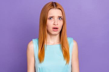 Photo of unhappy upset astonished amazed young woman problem bad mood isolated on purple color...