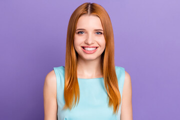 Portrait of attractive cheerful red-haired content girl wearing tank-top smiling isolated over purple violet color background