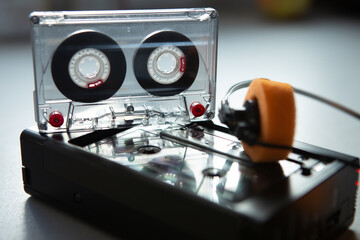 Music listening concept. Vintage cassette tape, audio player and headphones.