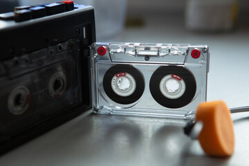 Music listening concept. Vintage cassette tape, audio player and headphones.