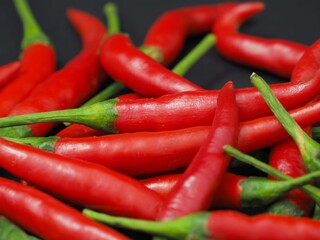 chili peppers on a black background