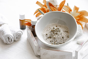 Spa composition with powder face mask and natural oils.