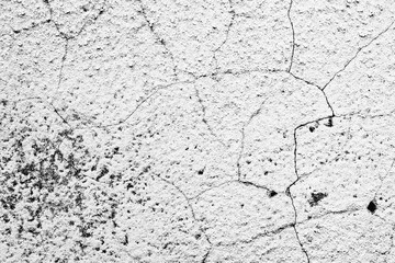 Texture of a concrete wall with cracks and scratches which can be used as a background