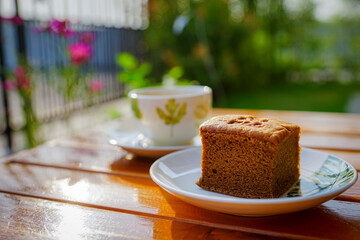 Coffee cake and hot coffee in the flower garden, refreshing in the morning
