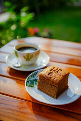 Coffee cake and hot coffee in the flower garden, refreshing in the morning