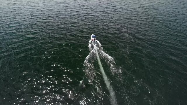 Small boat salling in the sea - Drone view