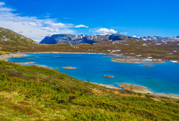 Fototapeta na wymiar Amazing Vavatn lake panorama rough landscape boulders mountains Hemsedal Norway.