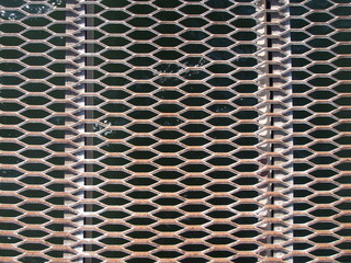 rusty metal grid walk way at the seaside 