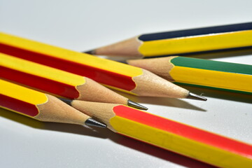 Pencils close up on white background.