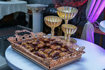 Traditional Moroccan stuffed dates with Dulce de leche and almonds served with milk