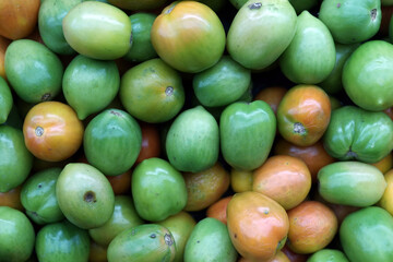 Green tomatoes at market