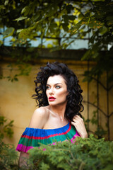 Woman wearing flowers dress in hot summer city