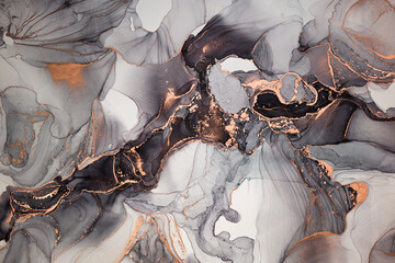 Luxury abstract fluid art painting in alcohol ink technique, mixture of black, gray and gold paints. Imitation of marble stone cut, glowing golden veins. Tender and dreamy design.