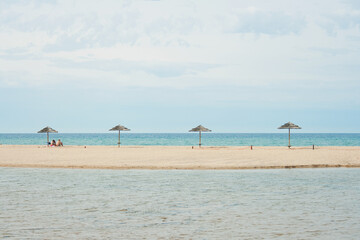 beach with umbrellas on a sunny day