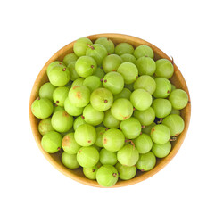 Indian gooseberry fruits in wooden bowl on white background