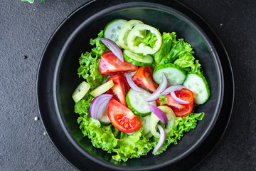 fresh salad organic vegetables tomato, cucumber, pepper, onion, lettuce meal snack copy space food background rustic. top view keto or paleo diet veggie vegan or vegetarian food