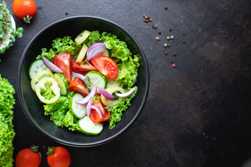 fresh salad organic vegetables tomato, cucumber, pepper, onion, lettuce meal snack copy space food background rustic. top view keto or paleo diet veggie vegan or vegetarian food