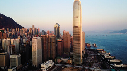 AERIAL. Top view of buildings in Hong Kong city at sunset.
