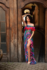 Woman wearing flowers dress in hot summer city
