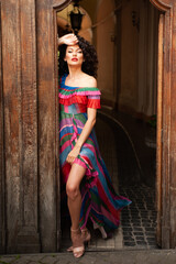 Woman wearing flowers dress in hot summer city