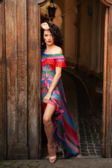 Woman wearing flowers dress in hot summer city